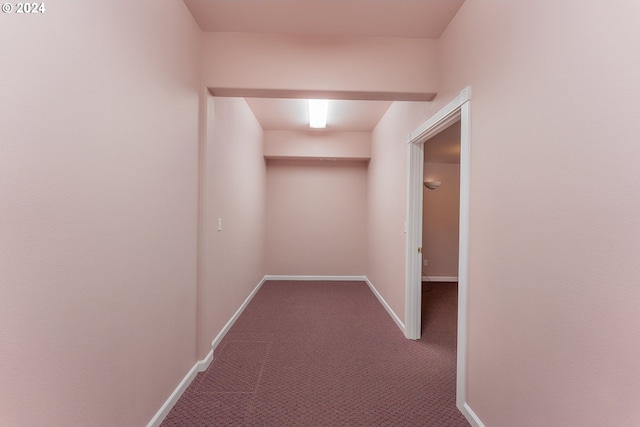 hall with carpet flooring