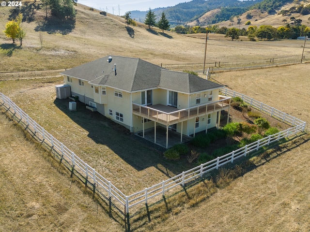 birds eye view of property featuring a mountain view and a rural view