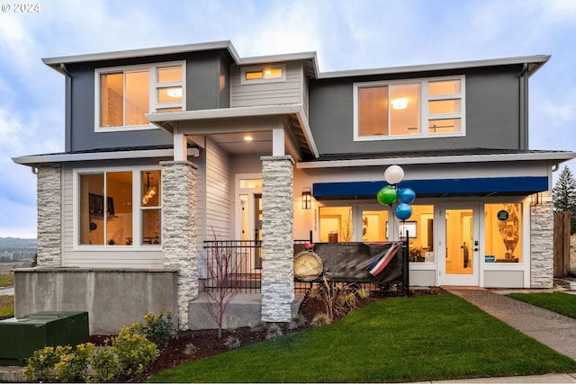 view of front facade featuring central air condition unit, french doors, and a front lawn