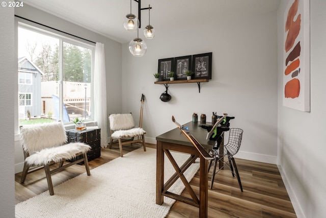 home office featuring baseboards and wood finished floors