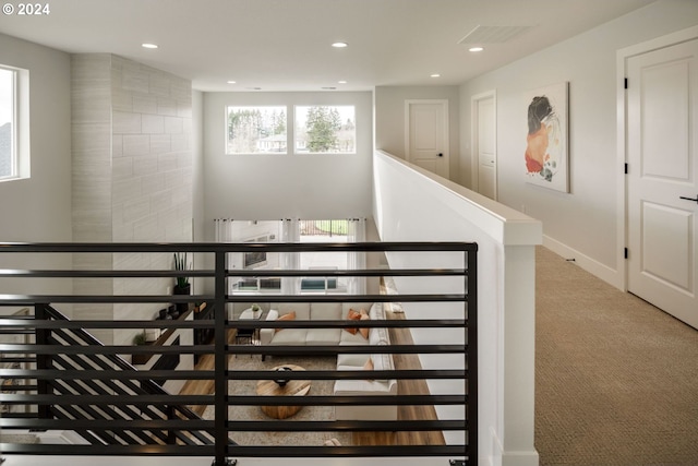 stairway featuring carpet floors, baseboards, and recessed lighting