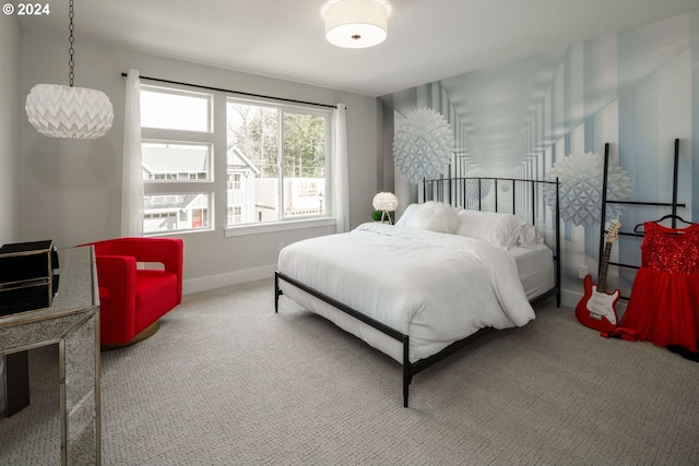 bedroom featuring carpet floors and baseboards