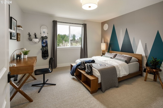 carpeted bedroom featuring baseboards