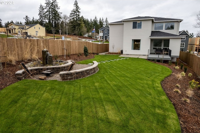 view of yard featuring a fenced backyard and a residential view