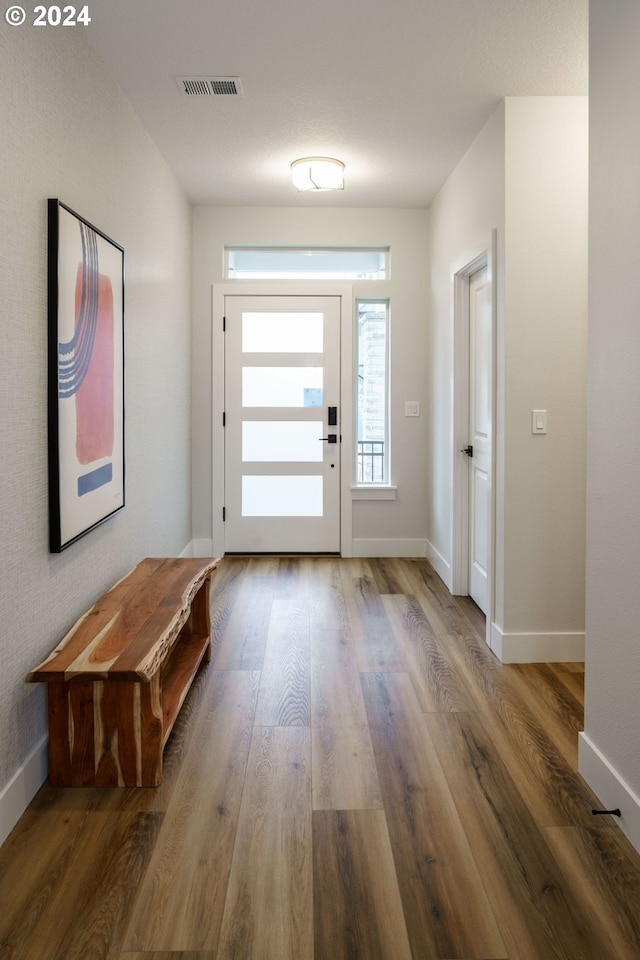 doorway to outside with hardwood / wood-style floors