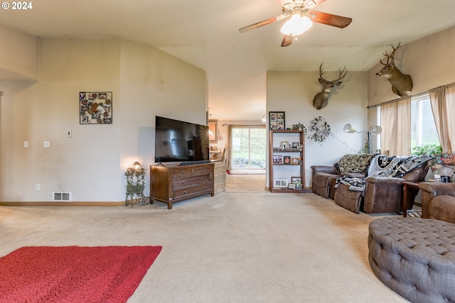 living room featuring light colored carpet and ceiling fan