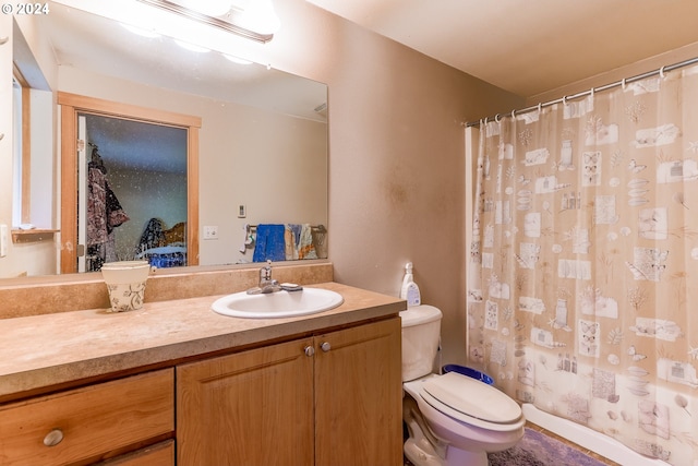 bathroom with oversized vanity and toilet