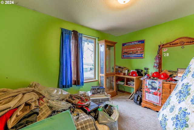 carpeted bedroom featuring a textured ceiling