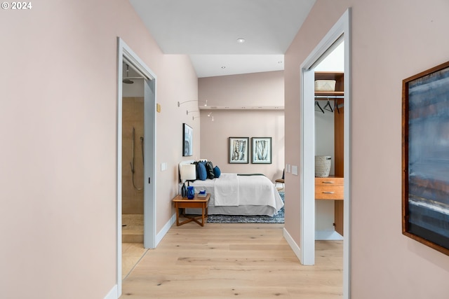 bedroom featuring light wood-type flooring and a closet