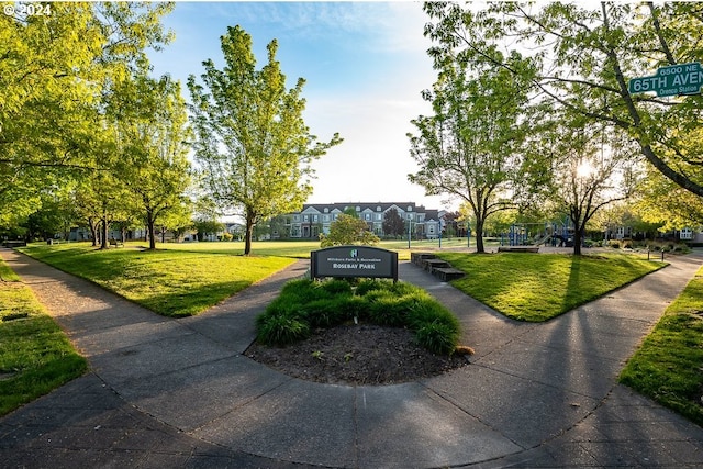 surrounding community featuring a lawn