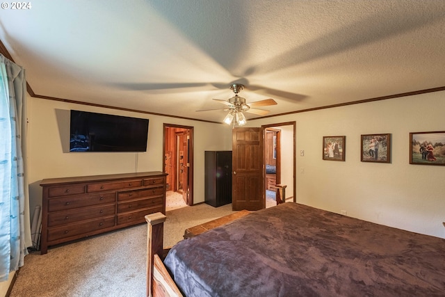 bedroom featuring ornamental molding, light colored carpet, a textured ceiling, and a ceiling fan