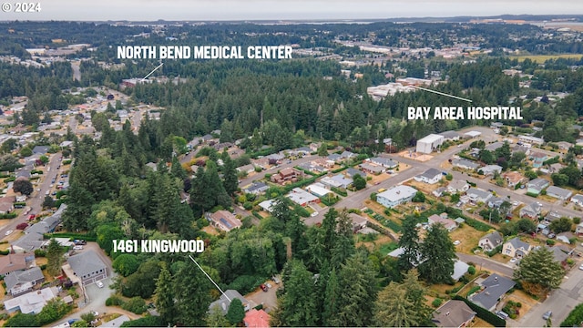 aerial view featuring a view of trees