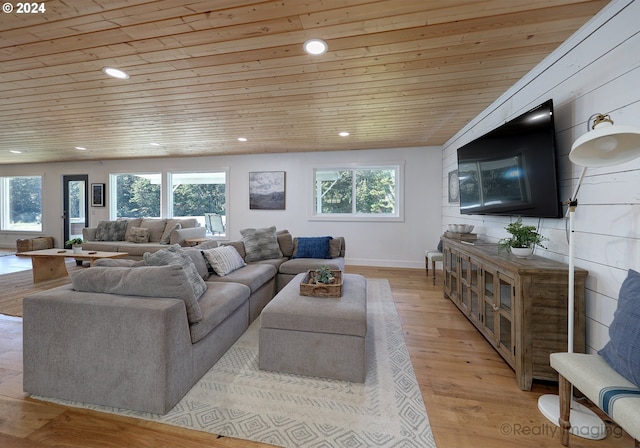 living room with wood ceiling, a wealth of natural light, vaulted ceiling, and light hardwood / wood-style floors