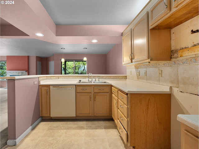 kitchen with light brown cabinets, sink, kitchen peninsula, white dishwasher, and decorative light fixtures