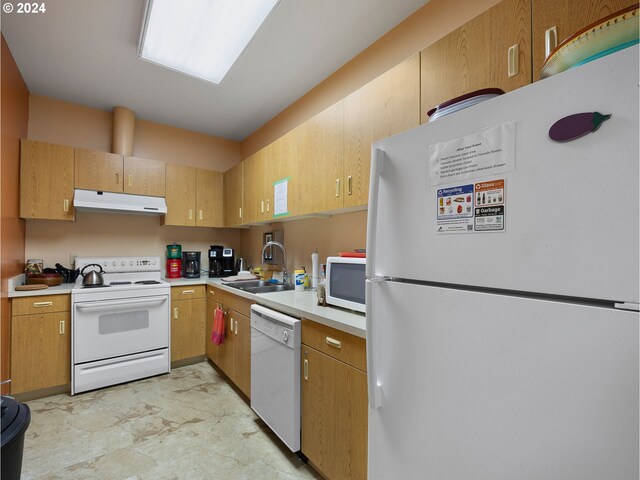 kitchen featuring sink and white appliances