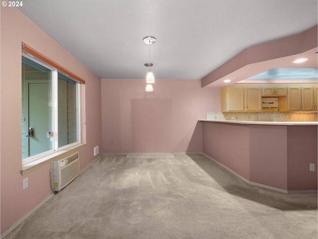 interior space featuring pendant lighting, light brown cabinets, a wall unit AC, light colored carpet, and decorative backsplash