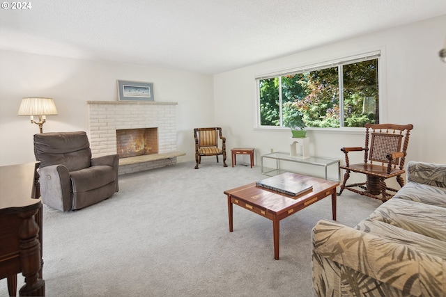 living room featuring light colored carpet, a textured ceiling, and a fireplace