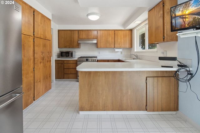 kitchen featuring stainless steel appliances and kitchen peninsula