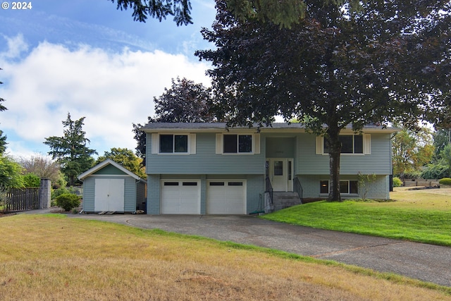 split foyer home with a storage shed and a front yard