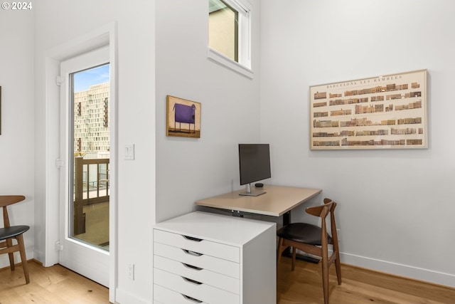 home office with light wood-type flooring