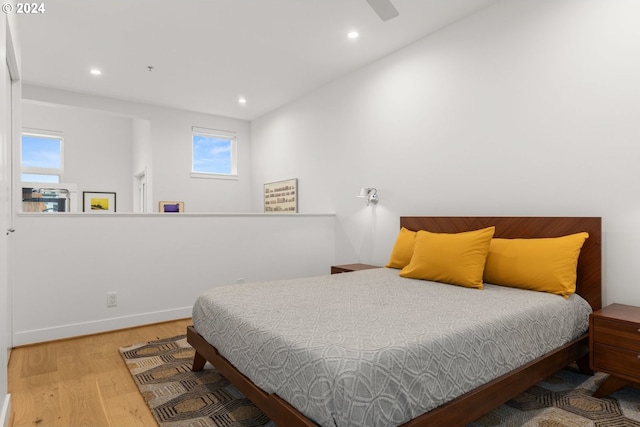 bedroom with hardwood / wood-style floors