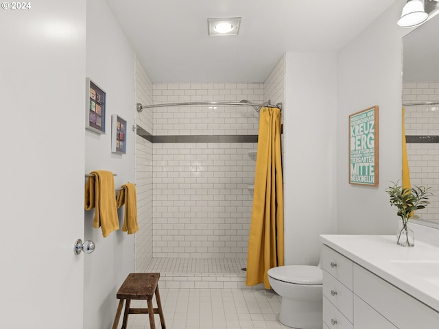 bathroom with vanity, tile patterned floors, curtained shower, and toilet