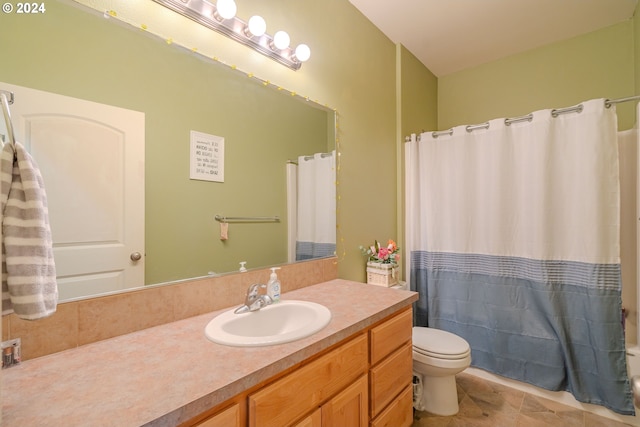 bathroom with vanity, toilet, tile patterned floors, and walk in shower