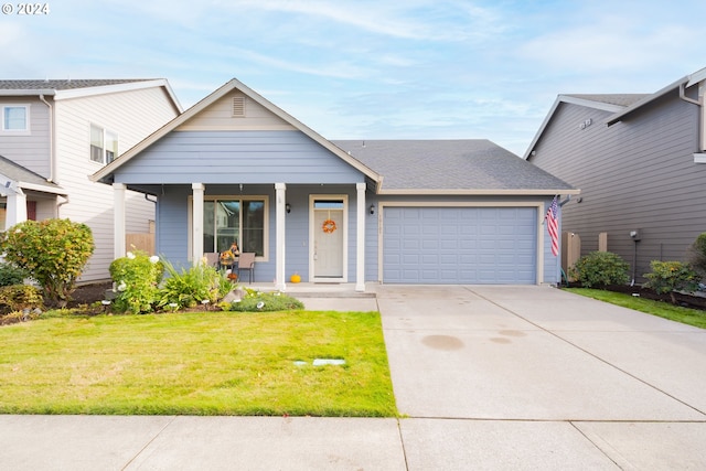 view of front of home featuring a garage and a front lawn