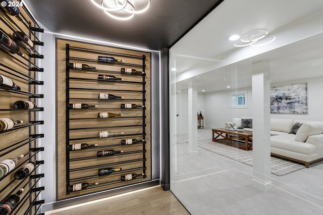 wine cellar featuring a textured ceiling and hardwood / wood-style flooring