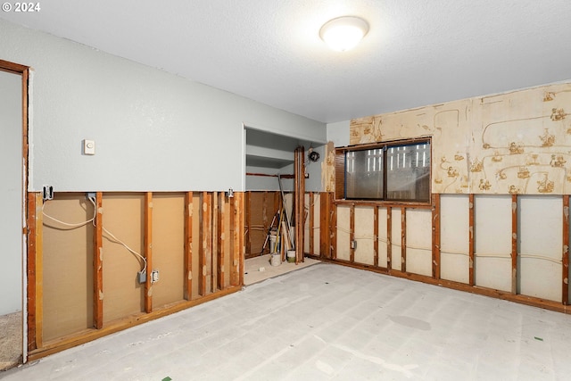 interior space with a textured ceiling