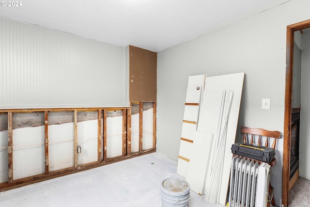 interior space featuring concrete flooring and radiator