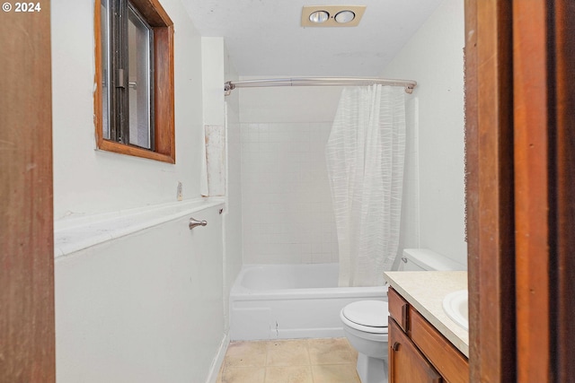 full bathroom featuring toilet, shower / bath combo with shower curtain, vanity, and tile patterned floors