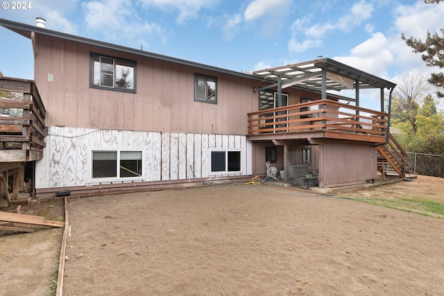 rear view of house with a deck