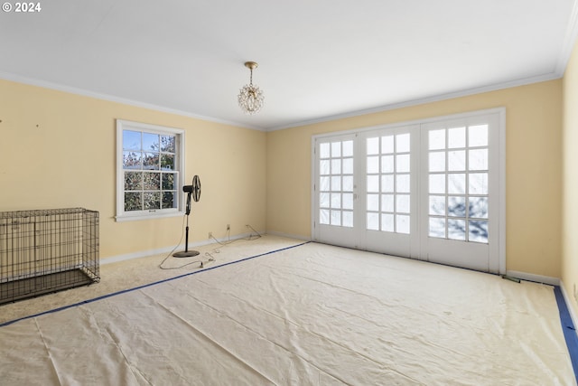 carpeted spare room featuring ornamental molding