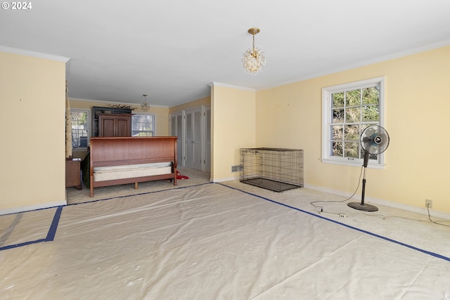 bedroom featuring ornamental molding and a chandelier