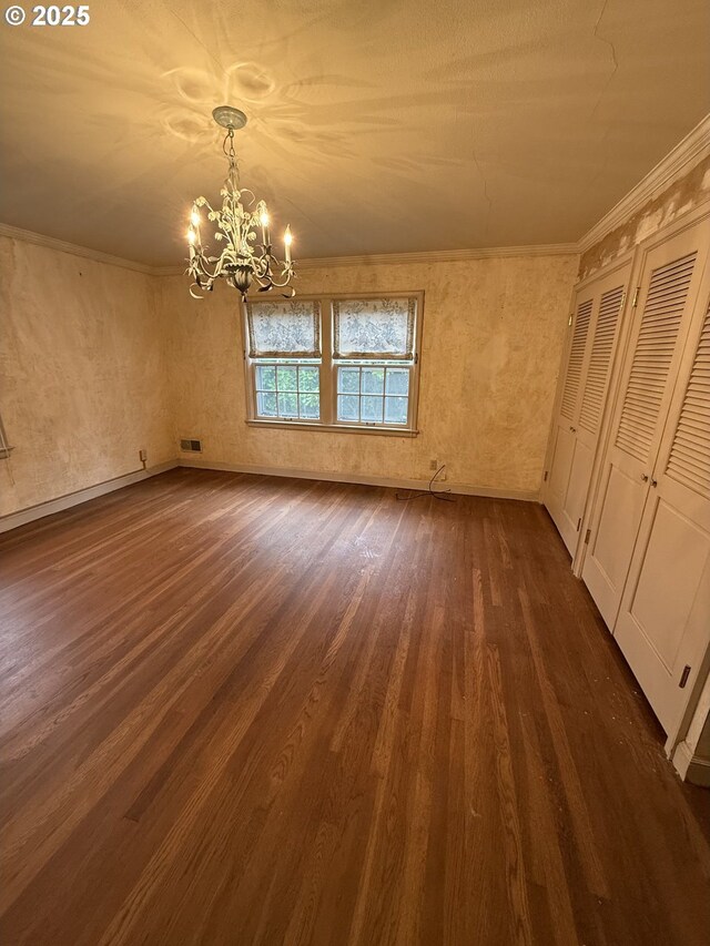 carpeted bedroom with a chandelier and ornamental molding