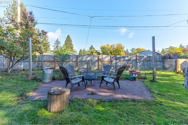 view of patio / terrace featuring an outdoor fire pit