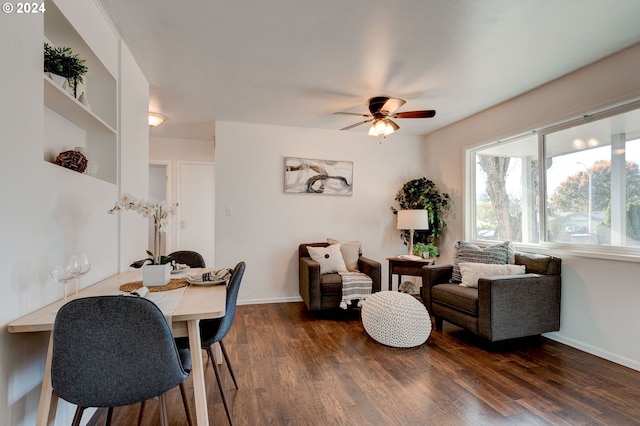 dining space featuring ceiling fan and dark wood-type flooring