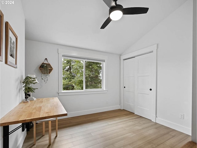office with ceiling fan, baseboards, wood finished floors, and vaulted ceiling