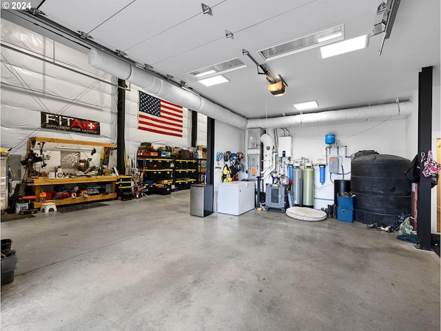garage with a workshop area and a garage door opener