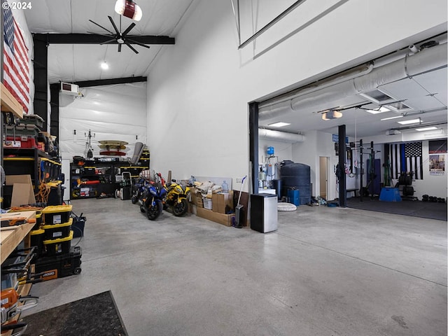garage featuring a workshop area and ceiling fan