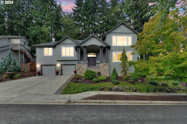 view of front of house with a garage and a porch