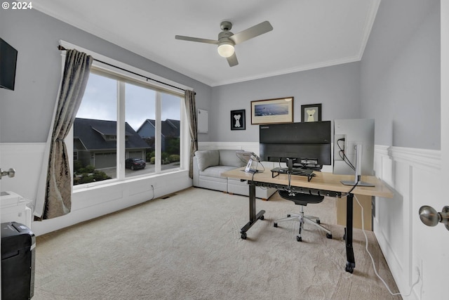 home office with ornamental molding, ceiling fan, and light colored carpet