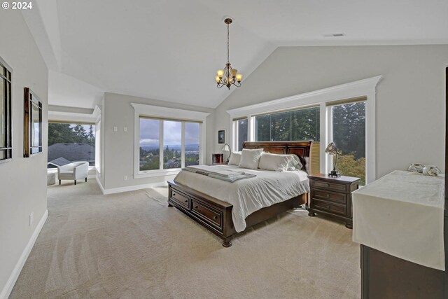 carpeted bedroom featuring an inviting chandelier and high vaulted ceiling