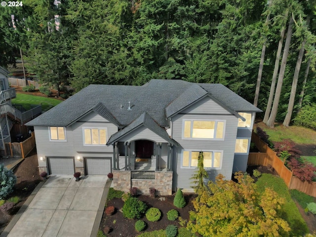 view of front of house with a porch and a garage