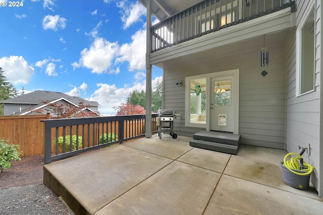 view of patio / terrace with grilling area and a balcony