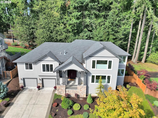 view of front of property with a garage and a porch