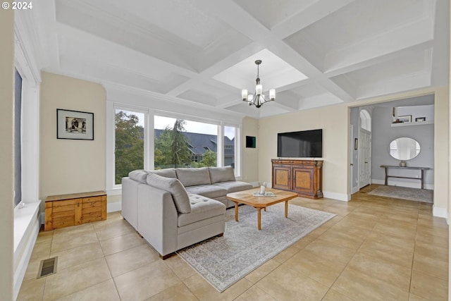 tiled living room with coffered ceiling, beamed ceiling, and a notable chandelier