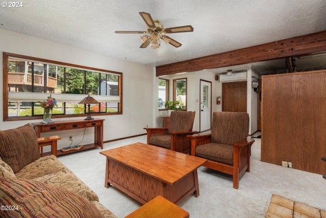 living room with a wealth of natural light, light colored carpet, and a textured ceiling