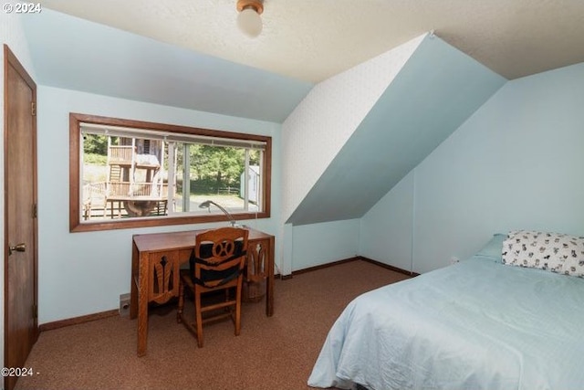 bedroom featuring lofted ceiling and carpet floors